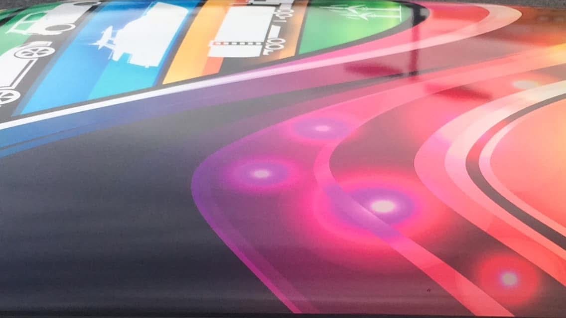 Close detail showing the flowing rainbow colour bands across the MINI roof