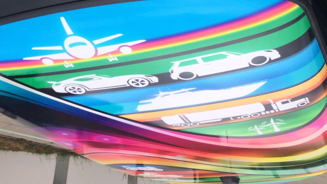 Full view of Daniel Hornby's competition-winning rainbow transport artwork fitted to the roof of a MINI